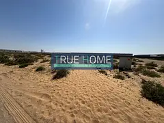 Land for sale in Al Sajaa, 11,300 sqft, on two streets
