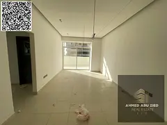 For annual rent in Ajman, a new building offers a two-bedroom apartment with a living room, three ba