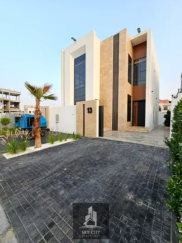 Villa for sale in Al Helio 2, Ajman. Super duplex with high-end finishes, registration fees include