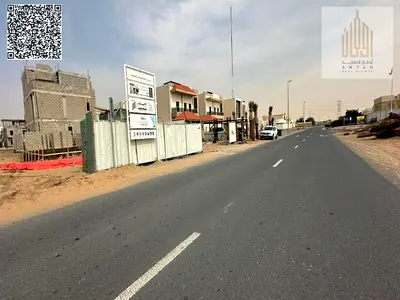 Residential investment land in Al Helio 1, located on a main road, with excellent features making it an ideal choice for investors or for future const