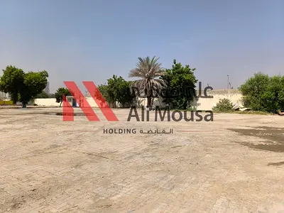 Spacious Open Yard for Rent – Ali Mousa Compound, Sajaa