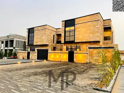 Villa for sale directly from the owner in Al Zahia with a 20-meter front setback and a stone facade. The villa includes registration and ownership fee