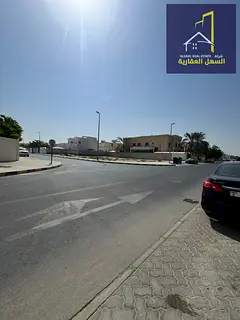 Residential land for sale in Al-Azra area, corner plot on two streets: 18 meters wide + 12 meters wi