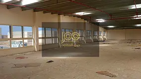 A fully integrated complex consisting of warehouses and shops, located on a main street.