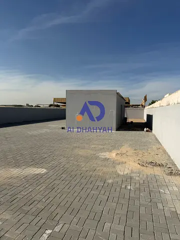 Land for sale in Al Sajaa – Al Jalil. Area 5,166 sq.ft, on paved road. Electricity fees paid and ready. Great location, ideal for investment