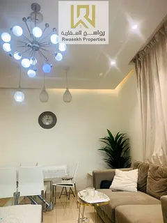 Real estate investment opportunity in Orient Towers, Ajman - 2 bedroom and hall apartment for sale w