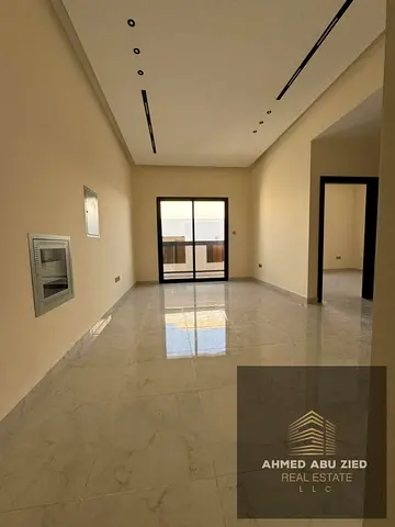 Brand-new 1BR + hall in Al Jurf, new building. 1 month free, 4/6 payments, master bedroom, 2 baths, balcony, central AC, prime location.