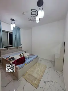 Own a spacious 2-bedroom apartment with a living room in Al Waha Towers, featuring high-quality fini