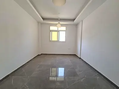 Like brand new building in Al jada out sid 1bhk 1wachroom 1month free no deposit 6chq possible