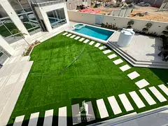 Enjoy luxury and comfort in this 10,000 sq ft villa with a large swimming pool, internal elevator, g