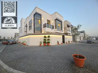 For sale in Al Helio 2, a deluxe villa with a swimming pool, consisting of 5 rooms, a hall, a hall, a kitchen, a preparatory kitchen, and external sto