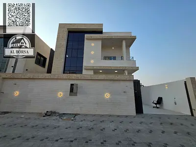 For sale, a villa in Al Zahya, Ajman, 4 master bedrooms, a living room, two halls, a kitchen with a maid's room, and a spacious yard.