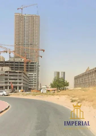 Al-Amrah, Ajman: Residential/commercial land (G+41) with permit for apartment sales. Freehold ownership for all.