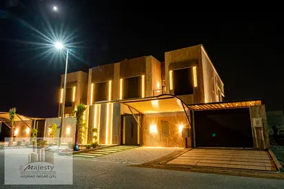 Two adjacent detached villas for sale in Al-Hawshi, each with 5 master bedrooms in a luxurious design, a separate men's majlis with a private entrance