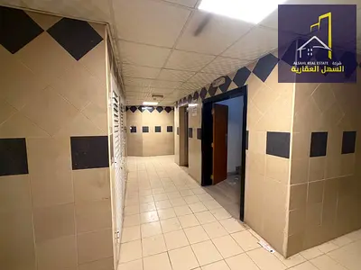 Building for sale in Muwailih commercial area, excellent location.