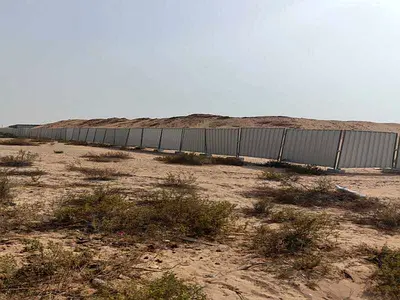 Industrial land for sale in Al Qasimia 1, with an area of ​​19,370 square feet.