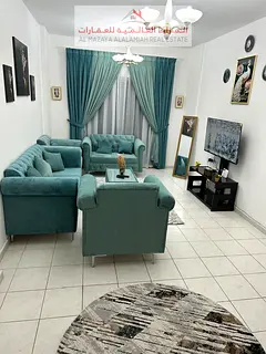 A fully furnished two-bedroom apartment with a living room in Al Taawun for monthly rent with intern