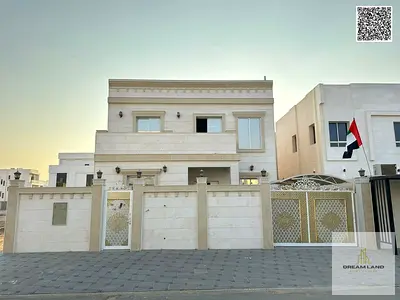 Two-story villa at an attractive price, 4 master bedrooms, prime location off Sheikh Mohammed Bin Zayed Road, freehold ownership for all nationalities