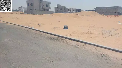 Land for sale in Ajman, Al Helio 1 area. Freehold ownership for all nationalities. Excellent location.
