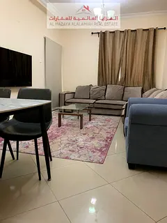 for rent monthly A fully furnished Two-bedroom Two-bathroom apartment in Al Taawun 1