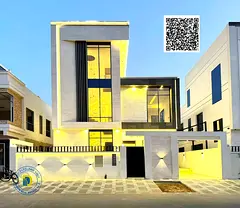 Luxury villa for sale in Al Yasmin area, 5 bedrooms, living room, majlis, and roof terrace. Attracti