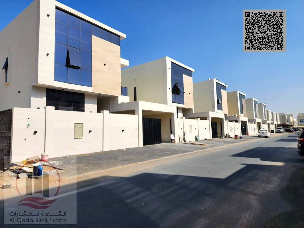 Villa for sale in Ajman, Al Yasmin area, including registration fees. 5 master bedrooms, majlis, 2 living rooms, and maid's room. Open to all nationa
