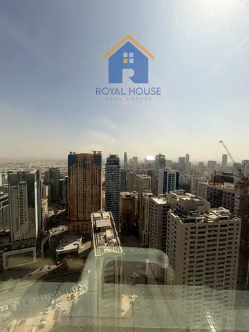 Three rooms for sale in Al Waha Tower with city views at a bargain price