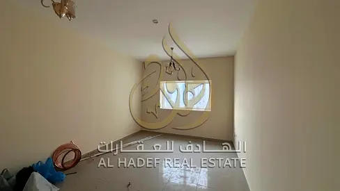 Two-bedroom apartment with a living room, two months free, a balcony, and two bathrooms in a prime location behind Mega Mall.