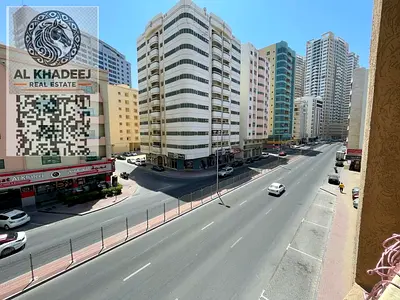 Two rooms and a hall, unfurnished, with a balcony with an open view, in Al Rashidiya 3, Al Muroor Street, close to the Corniche, easy access to Dubai
