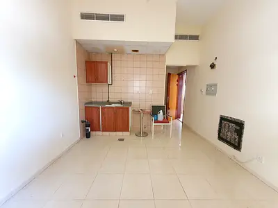 READY TO MOVE STUDIO ON ROAD BUILDING WITH CENTRAL AC IN MUWAILEH