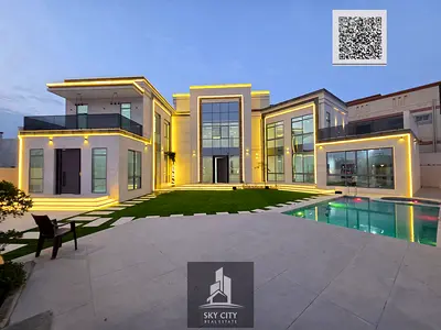 Al Yasmin, opposite Al Rahmaniya and Sharjah Sustainable City. Ground floor, first floor, and roof. Central air conditioning with a yard and swimming pool. 7 master bedrooms, majlis, 2 living rooms, m