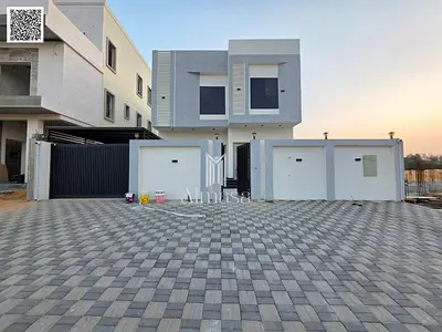 Luxury two-story villa for sale in Al Helio 2 area, Ajman. Modern design and prime location at an attractive price including registration and ownershi