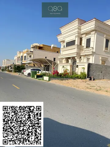 أرض فيلا للبيع على الطريق الرئيسي في منطقة العمرة | بناء معتمد من طابقين (أرضي + طابقين) | بجوار طريق E311 عجمان