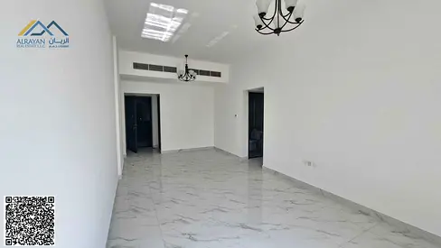 Two-bedroom apartment with a living room and three bathrooms for rent in Al Rawda 3, Sheikh Ammar Street.