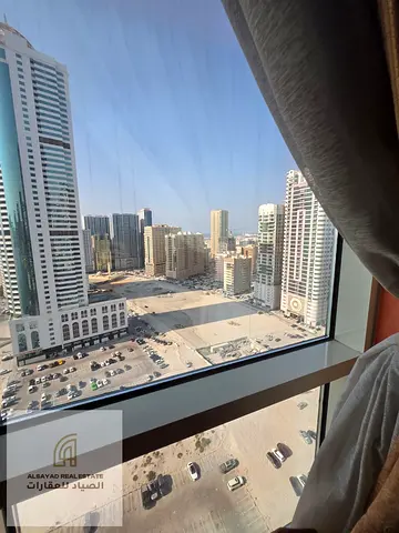 Two-bedroom apartment with a living room and parking for sale in Al Khan – Sharjah.