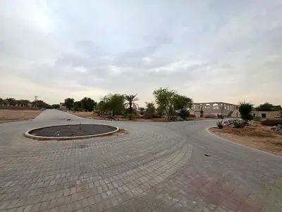 “Exclusive directly from the developer: premium residential plots in the Al Yasmeen area, with installment plans available for all nationalities, dire