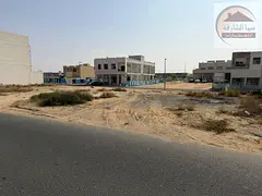 For sale: a residential plot of land in Al Hawshi area, Sharjah Emirate, corner plot on a street and