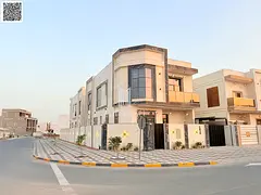 Corner villa on two streets with electricity and water in Al Zahia, opposite Al Qabail Mall, front s