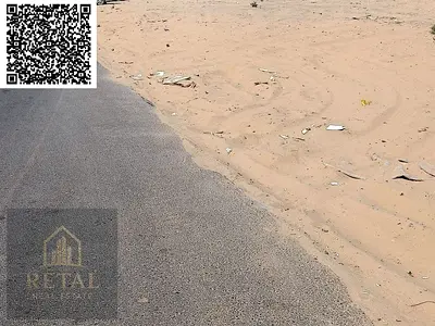 Residential land for sale in Al Yasmin, Ajman, behind the park.