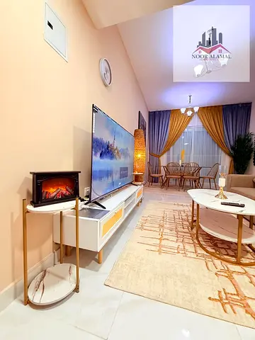 Sharjah, Al Taawun, first occupancy, two bedrooms, living room, kitchen, two bathrooms, and balcony. Price 5500 AED including internet, parking,