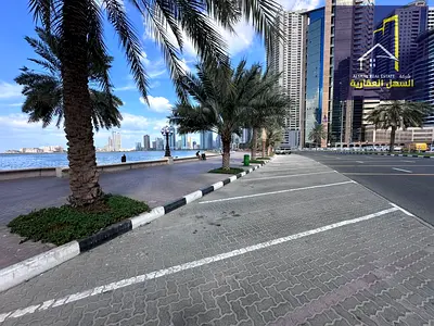 For sale: Residential/commercial land plot in a prime location with a full sea view overlooking Al Khan Lake, Sharjah. Tower permit available.