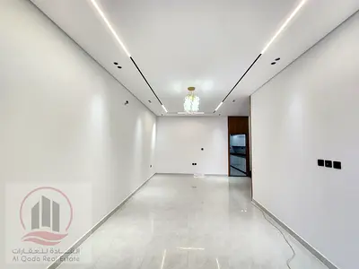 Villa for sale in Al Helio2 area, Ajman. Modern design. The villa includes registration fees and features 5 master bedrooms, a living room, a majlis