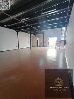 Warehouse for annual rent in Al Jurf 1 - with a large additional mezzanine area - equipped with a hi