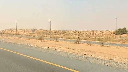 Corner commercial plot for sale in Sharjah, Al Balida 1 area, Al Bataeh suburb.