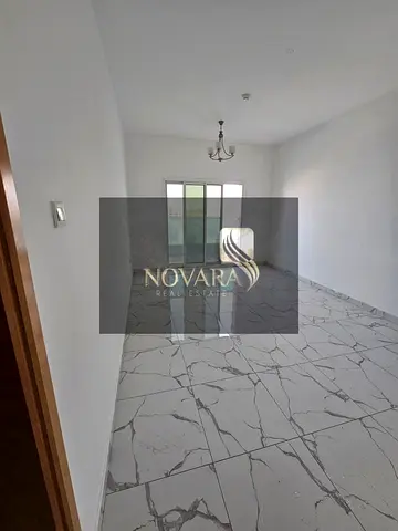 Apartment for annual rent, two bedrooms and a living room, in Al Jurf Industrial Area, 3 spacious separate living rooms.