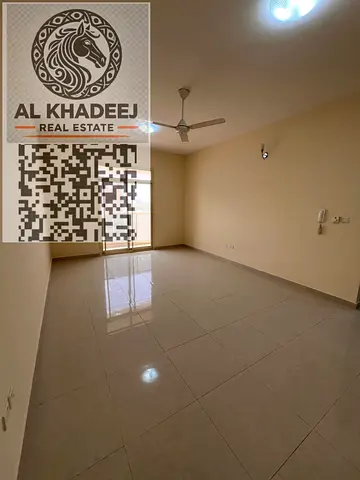 Two bedrooms and a spacious living room with a balcony overlooking the area of ​​Al Muwaihat, Ajman, close to all services and main roads.