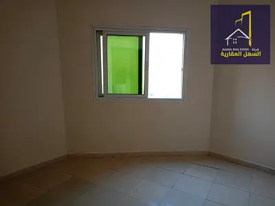 2-Bedroom Apartment with a Living Room and Balcony Facing a Main Street