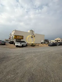 For Arab investors: a commercial land in Al-Hawshi on the main street, corner on three streets, exce