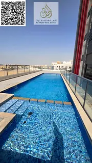 Beautiful two-bedroom apartment in Al Hamidiya with free parking, gym, and swimming pool inside the