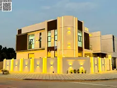 A luxurious villa situated on a corner lot, featuring a modern design, high-end finishes, and a gard